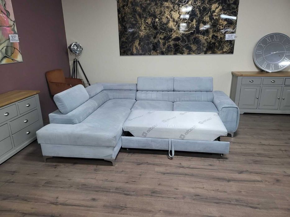 ПРОМОЦИЯ! Светло син ъглов диван от плат с функция сън и ракла