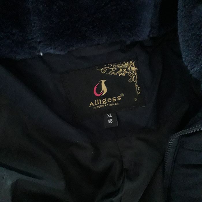 Зимняя пуховое  пальто.