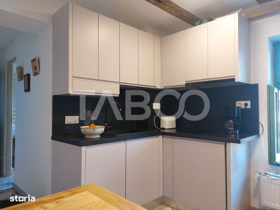 Apartament de vanzare 105 mp 3 camere curte 340 mp in acte Cisnadie
