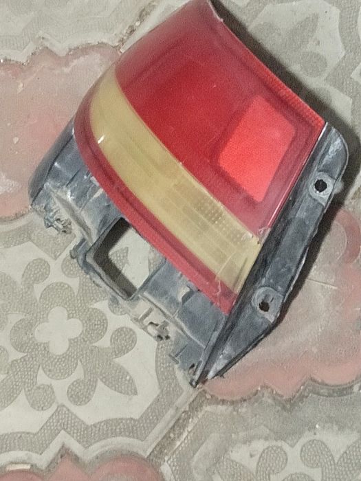 Тойота Карина Е задний левый фонарь оригинал.