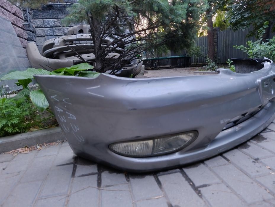 nissan a33 передний бампер