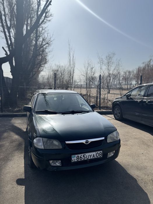 Мазда 323  кандёрмен
