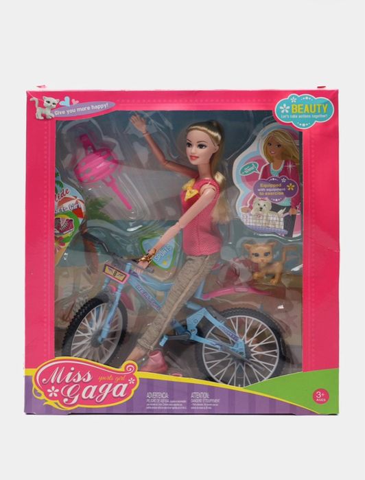 Кукла барби на велосипеде