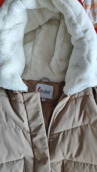 Новый пуховик 48 размера