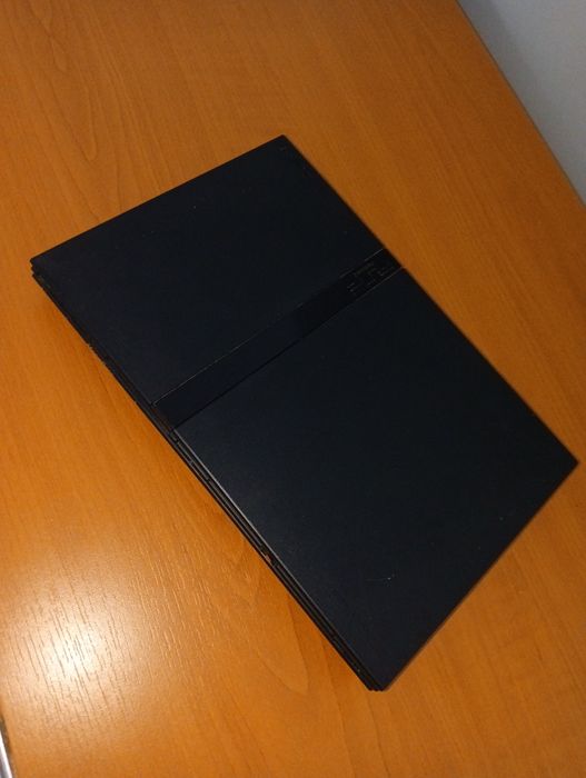 PlayStation 2 Slim + 8 jocuri + manetă