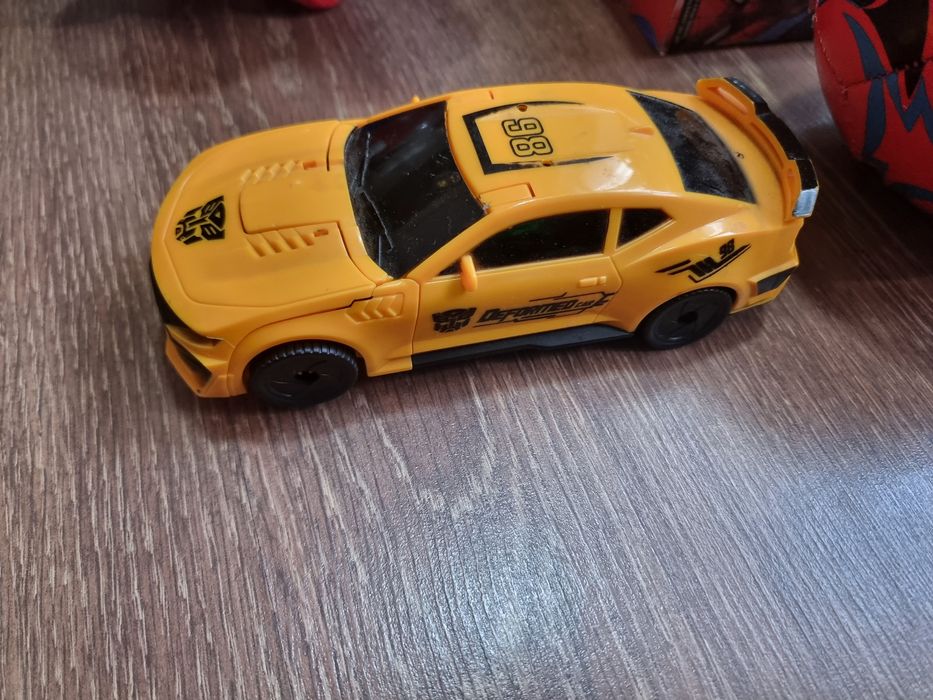 Цена за все Игрушки 2 шт трансформер светомузикалний работает Каталка