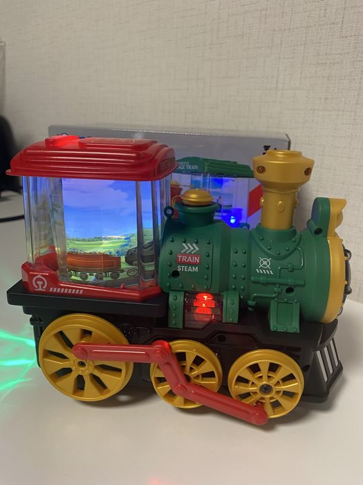Детски музикален локомотив с пушек, светлини и въртящи се картинки