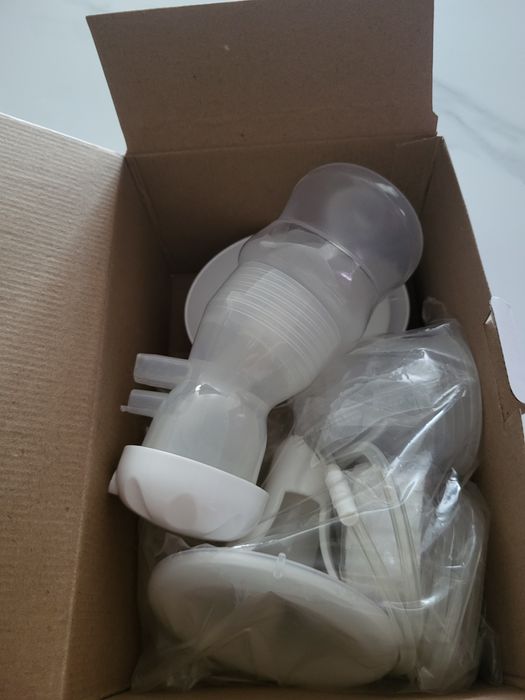 Электрический молокоотсос  Ramili