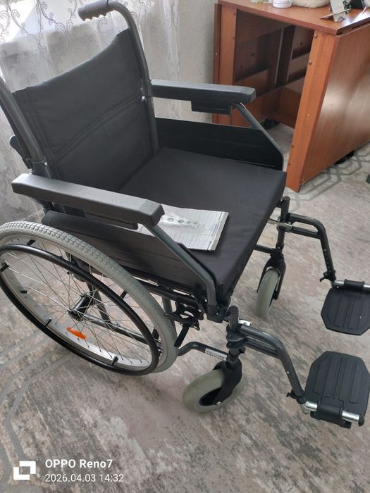 Инвалидная коляска.