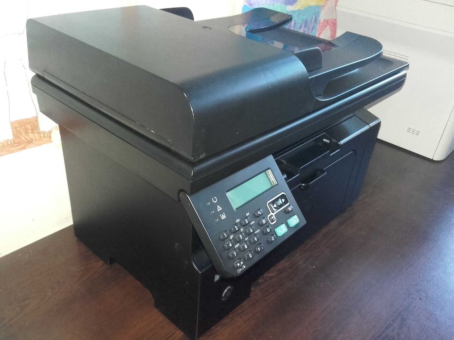 Като нов! Лазерен принтер,скенер и копир 3 в 1 HP LaserJet M1212nf MFP с мрежа и ADF