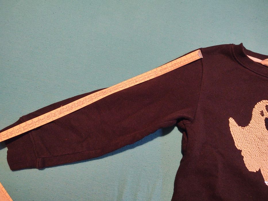 Блуза НМ с обръщащи се и светещи в тъмното пайети