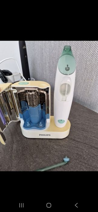 Dus bucal Philips si sterilizator capete periute de dinti