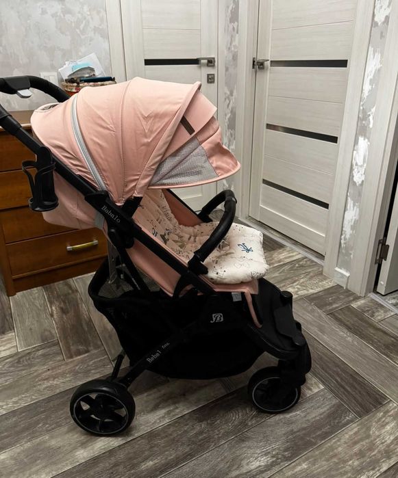 Коляска для девочки розовая