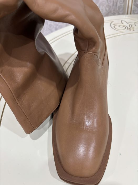 Продам новые рыжие кожаные сапоги