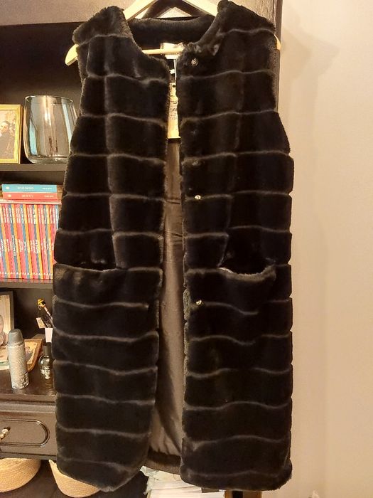 Vesta blana artificiala