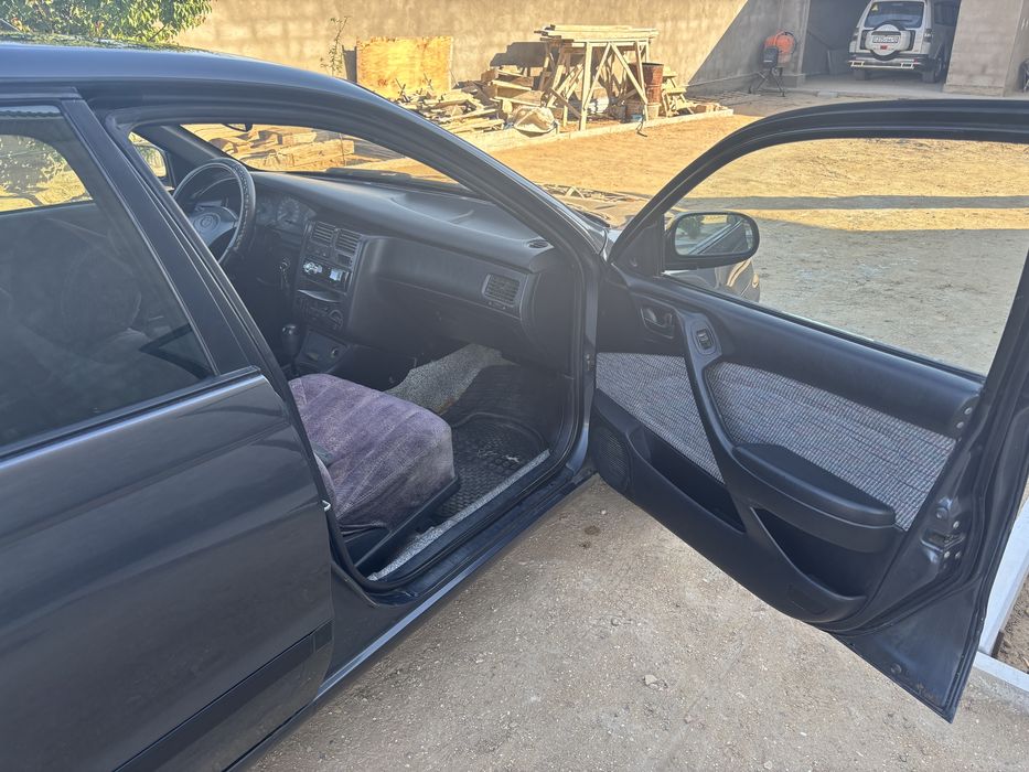 Тойота карина Е