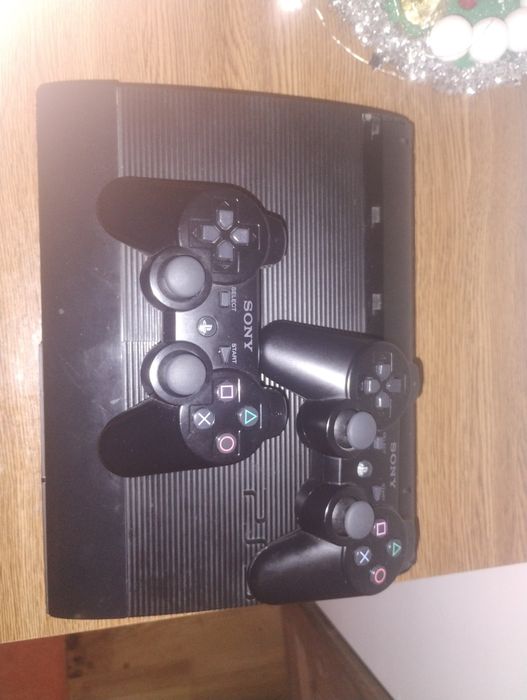 PlayStation 3 Superslim 500 GB MODAT HEN 4.92+32 de jocuri+2controlere