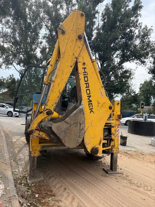 Экскаватор погрузчик 3в1