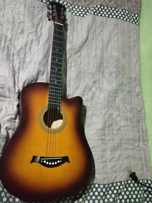 Gitara akustik mawkala yozmela