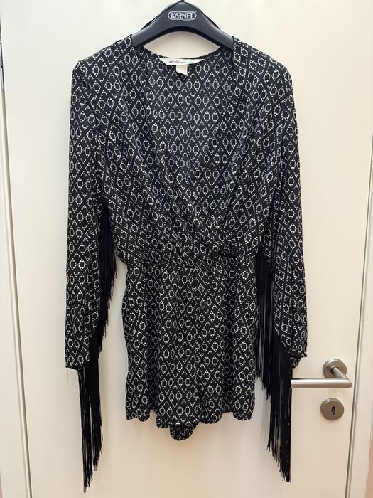 Екстравагантен гащеризон с ресни по ръкавите