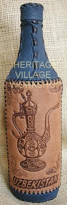 Бутылки сувенирные декорированные кожей.