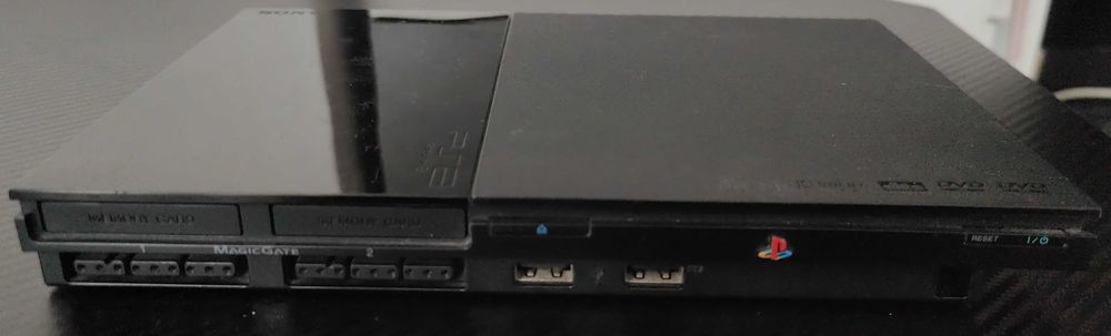 Playstation 2 model slim,modat, cu 33 jocuri de top ,maneta ,cabluri