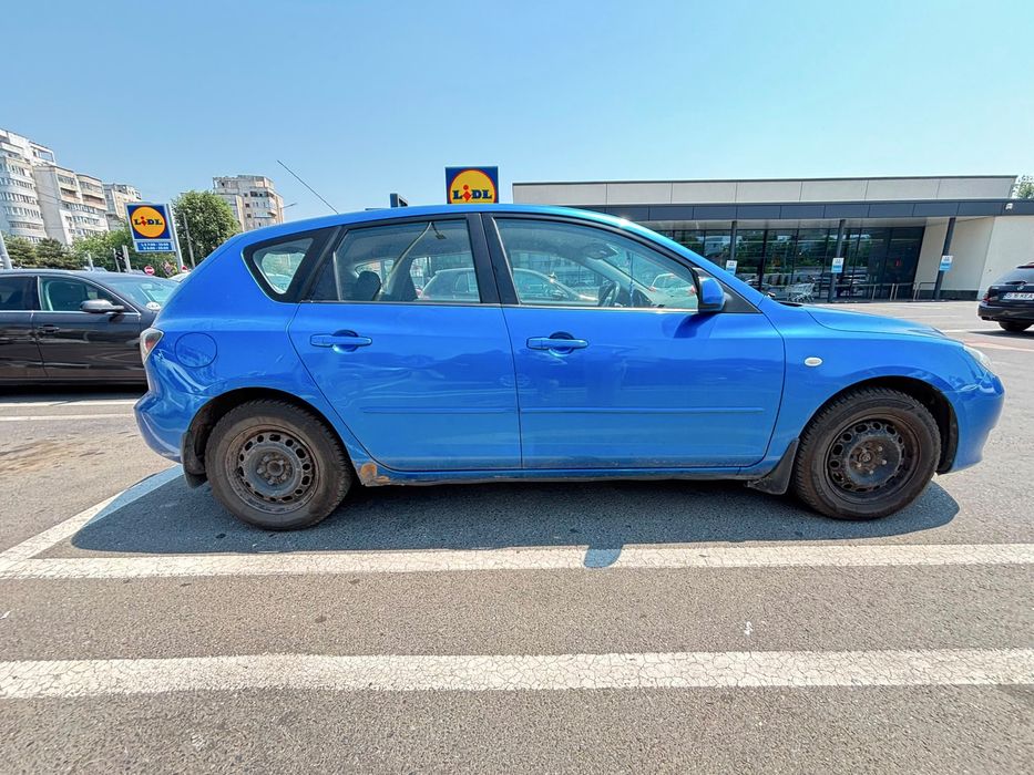 Vand mazda 3 1.4 benzina an 2006 masina merge fine traga bine nu are nimic propleme