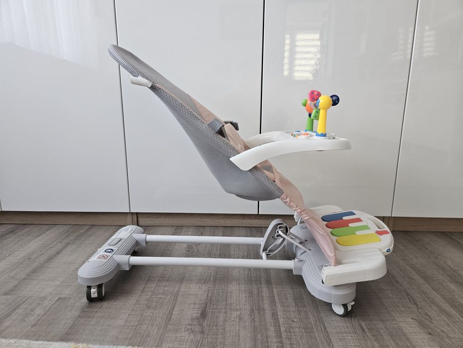 Balansoar bebeluși NiceKids, roz, pliabil, cu pian și jucării