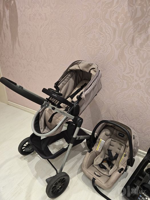 Классная коляска 3 в 1 Evenflo Pivot Travel System + автокресло