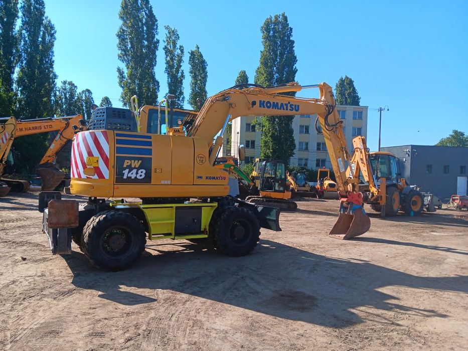 Vând sau schimb excavator komatsu PW 148
