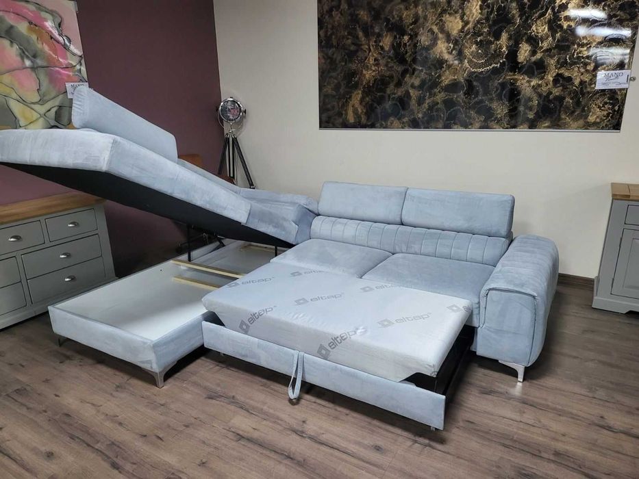 ПРОМОЦИЯ! Светло син ъглов диван от плат с функция сън и ракла