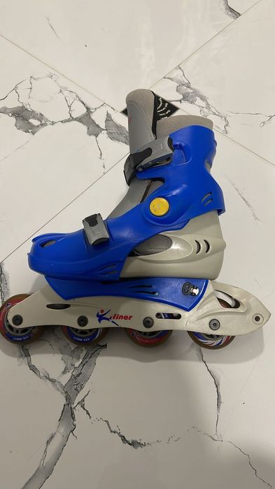 Роликовые коньки