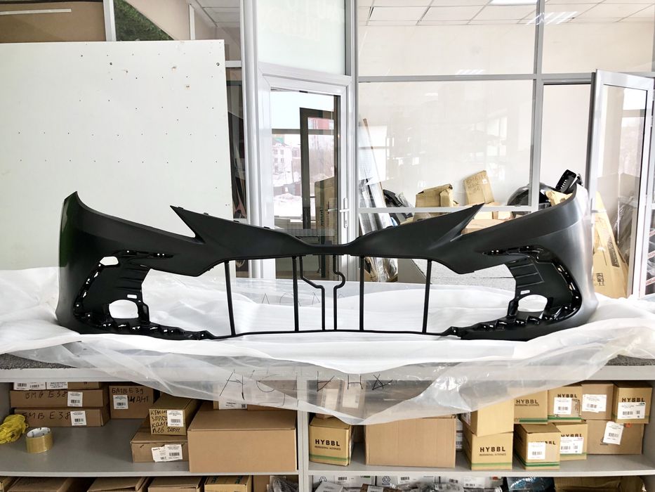 Передний бампер Камри 75