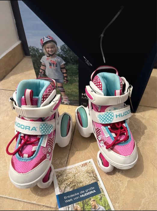 Patine cu rotile mărimi reglabile 26-29 - Roz, stare foarte buna.