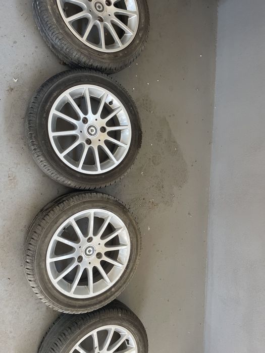 Vand 4 jante aluminiu cu anvelope vara R 15