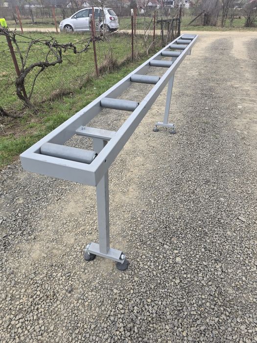 Conveior cu role transportatoare si măsurare  pentru debitare