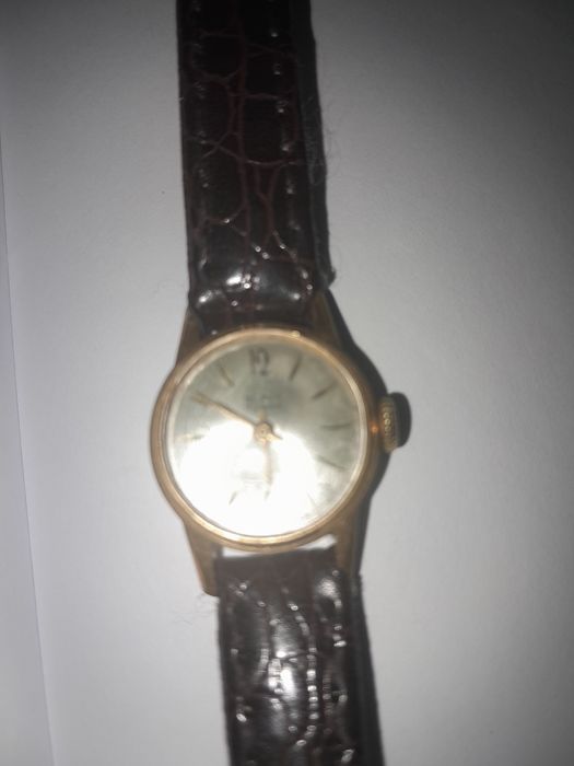 Продам позолоченые часы .