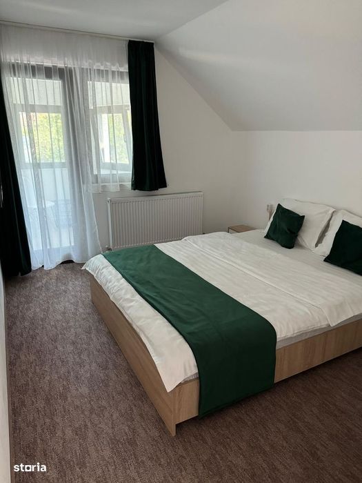Casă cu 9 camere și mansardă