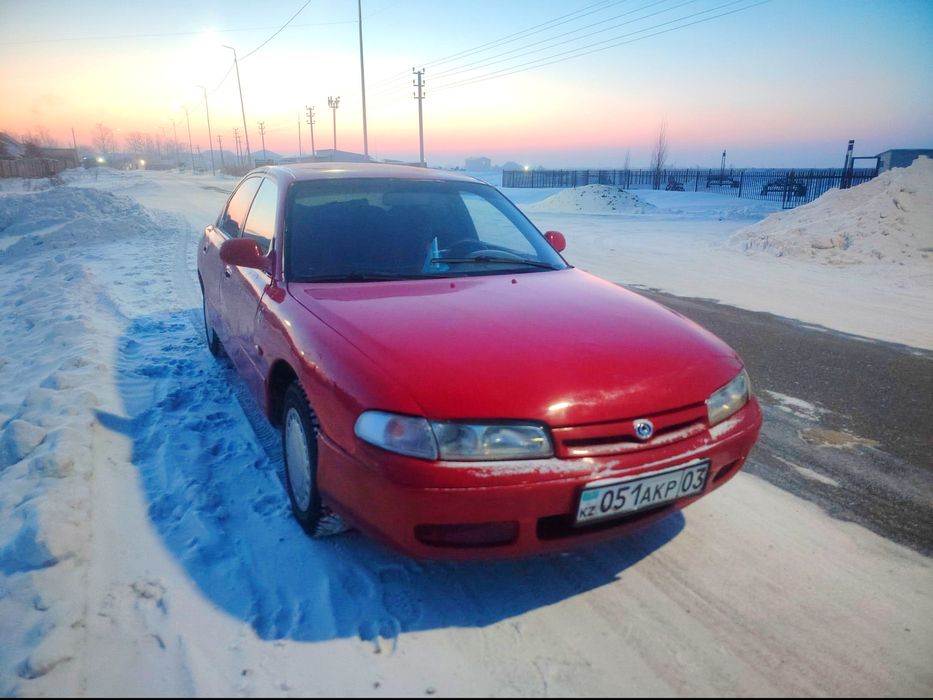 Мазда кронус на ходу.