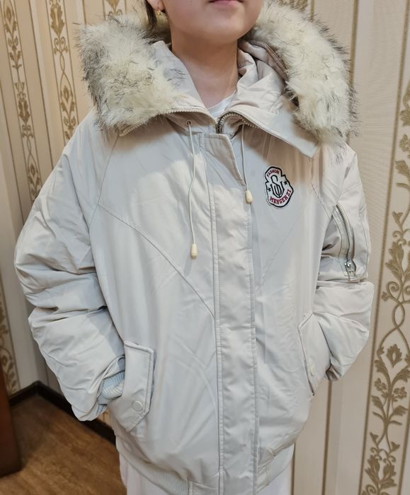 Продам пуховик на 12-14 лет