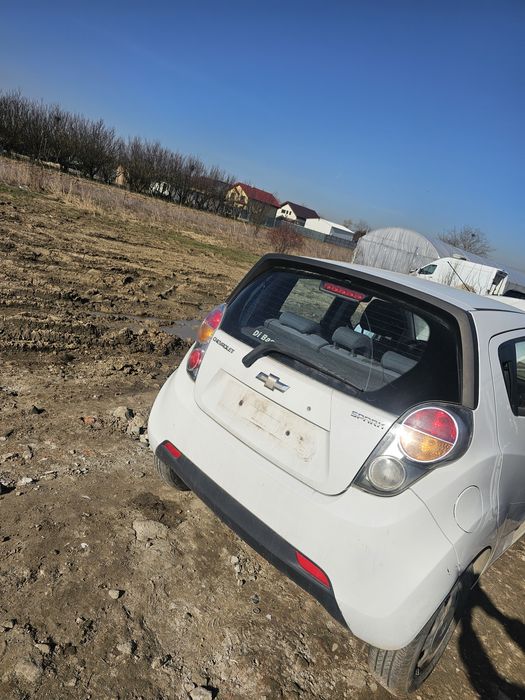 Dezmembrez  Chevrolet spark 2012 piese motor cutie uși haion aripi