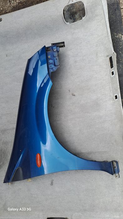 калник Nissan Almera Tino  2000-2006