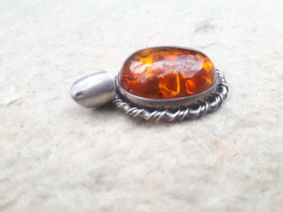 Серебряный кулон.