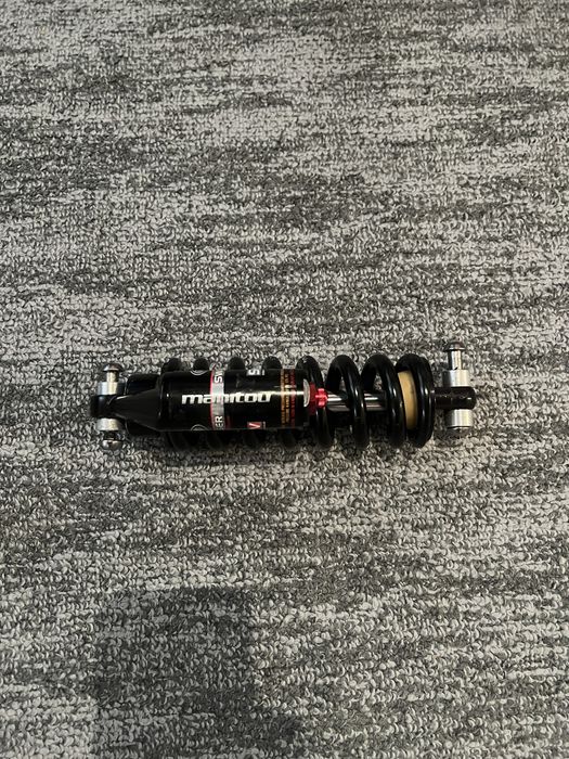 Shock manitou swinger