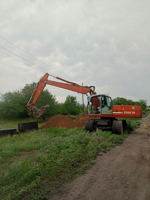 Услуги колесного экскаватора