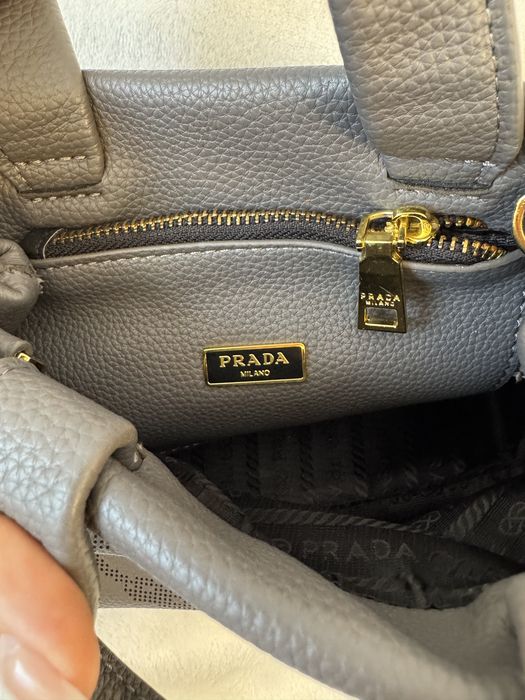 Geanta Prada, defect manere