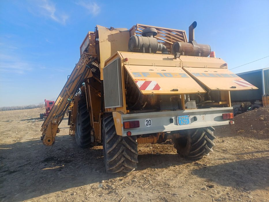 Свекло уборочный комбайн