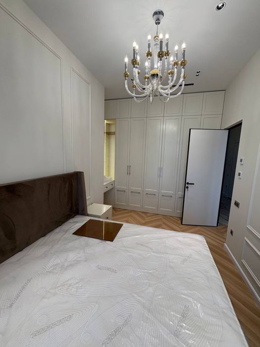 NestOne квартира 23 этаж 59м Блок А. Балкон в Ташсити парк смотрит