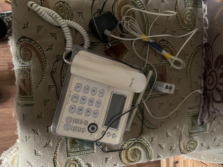 Новый модем роутер и многофункциональный стационарный телефон б/у в по