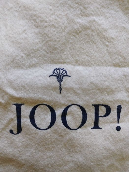 Husa protectie praf, alb/crema de la brandul: Joop! Folosinta: o data!